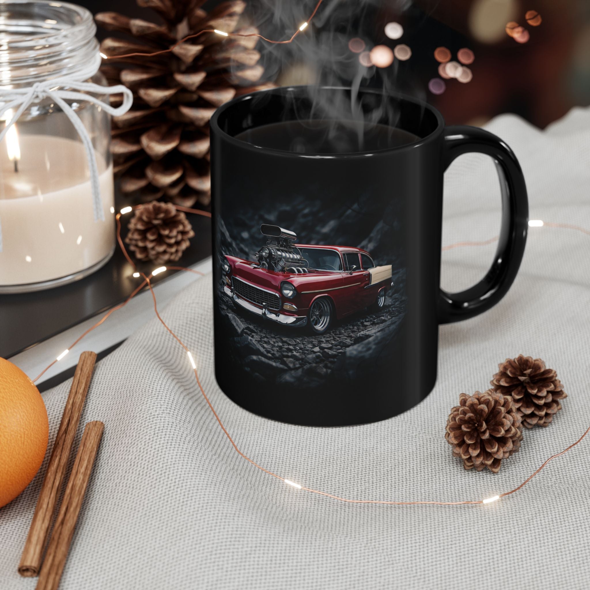 Black mug with a car design on a table with decorative items