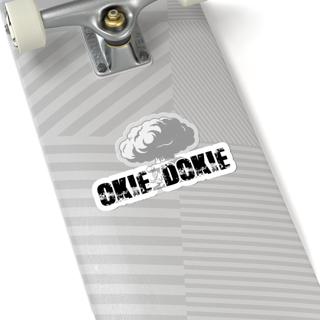 Skateboard deck with 'OKIE DOKIE' sticker on a white background