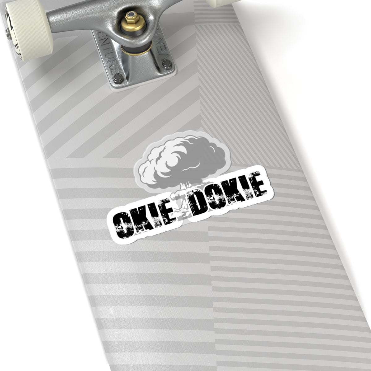 Skateboard deck with 'OKIE DOKIE' sticker on a white background