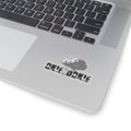 Laptop with a sticker on the palm rest area featuring a logo and okie dokie text.