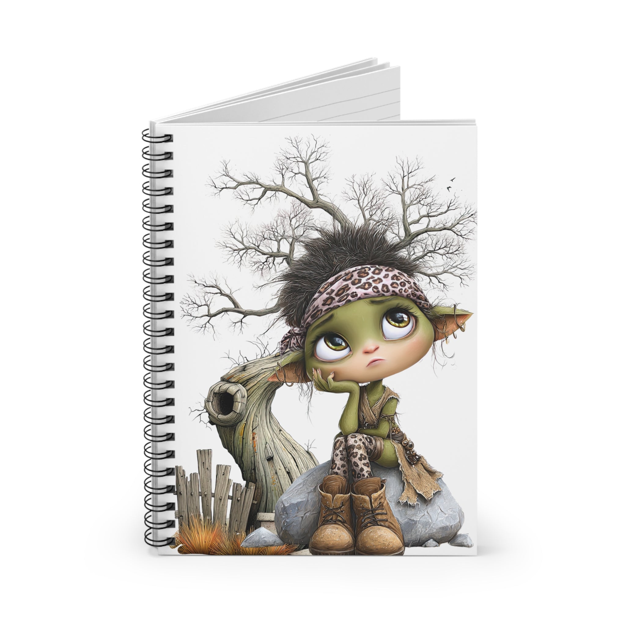 Whimsical fairy spiral notebook with ruled lines, featuring a cute art journal cover of a green fairy sitting by a tree stump.