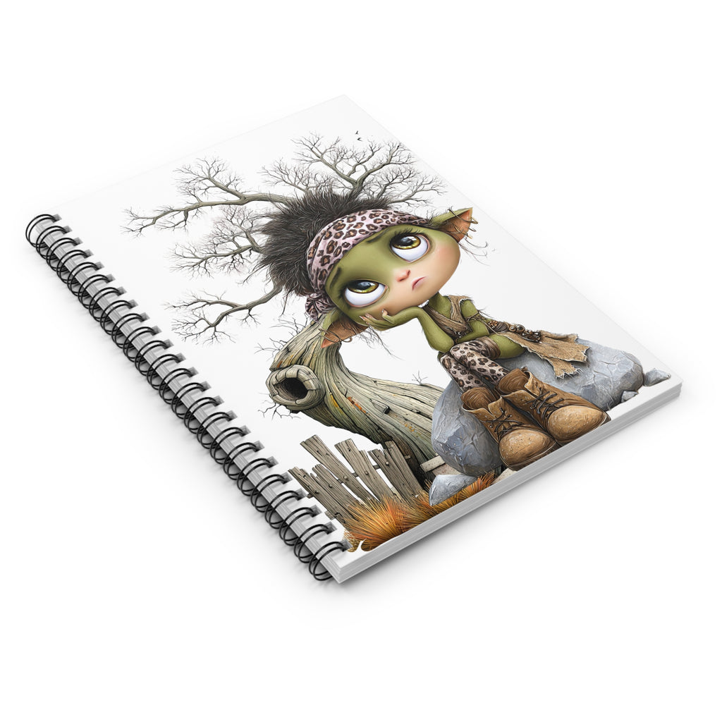 Whimsical Fairy Spiral Notebook with cute green fairy, leopard print bandana, sitting on a rock against a tree.