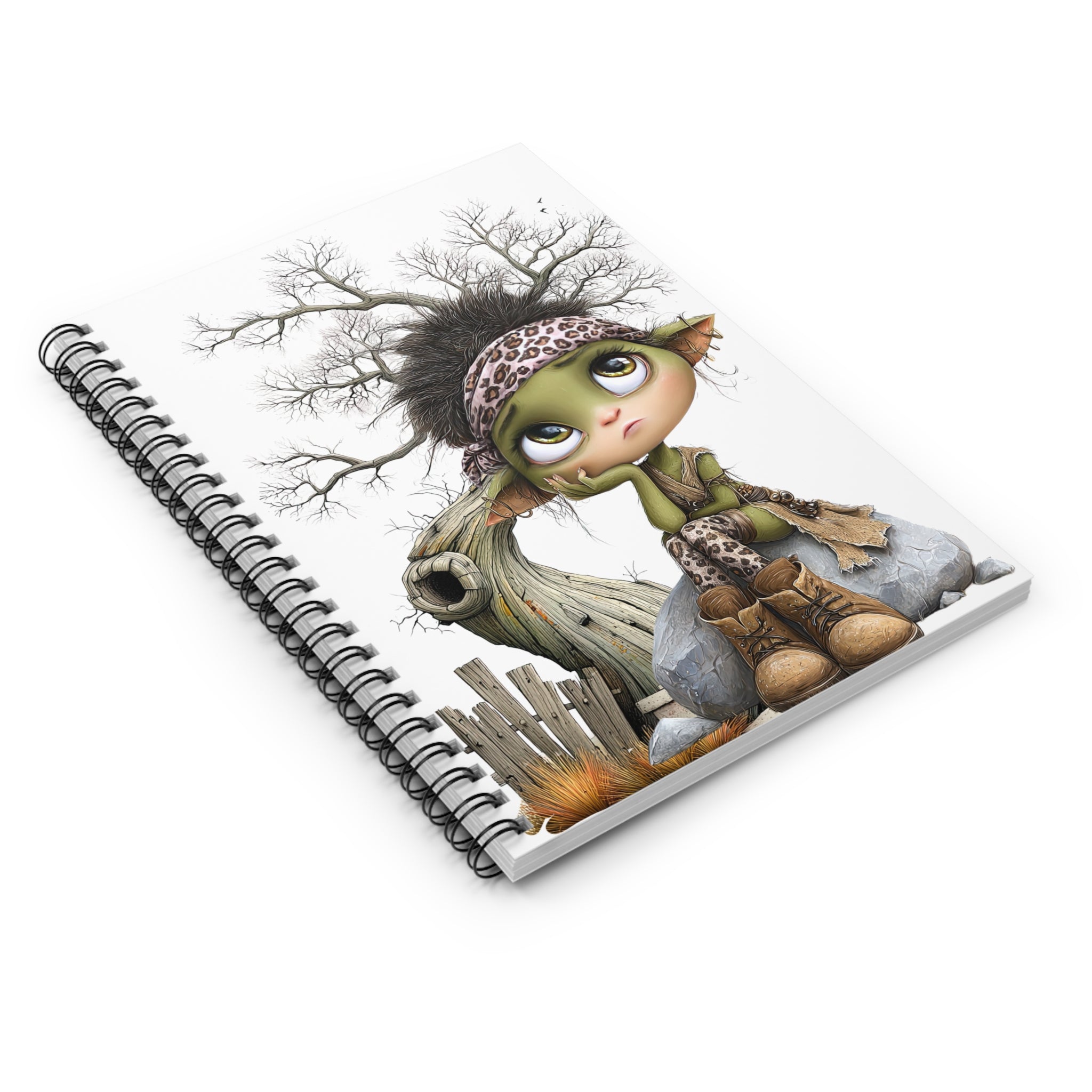 Whimsical Fairy Spiral Notebook with cute green fairy, leopard print bandana, sitting on a rock against a tree.