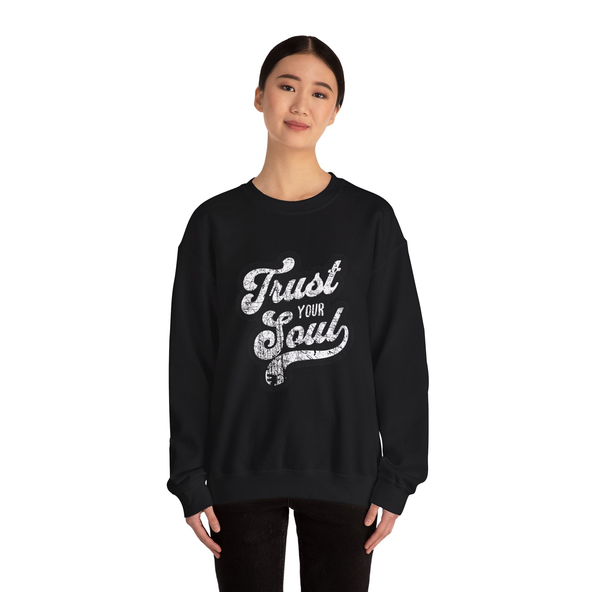 Model wears black 'Trust Your Soul' unisex crewneck sweatshirt for cozy casual wear