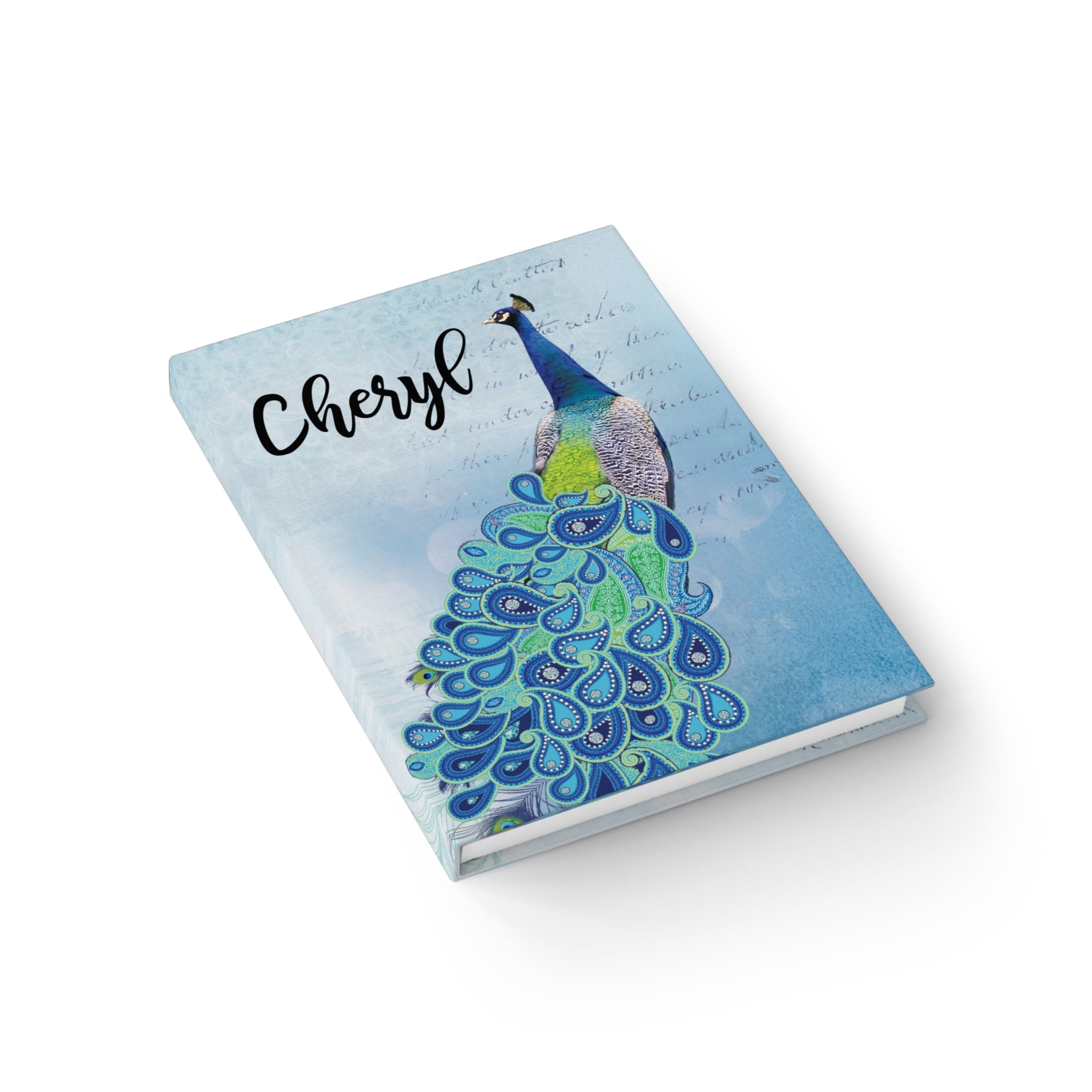 Notebook with a peacock design and the name 'Cheryl' on a white background