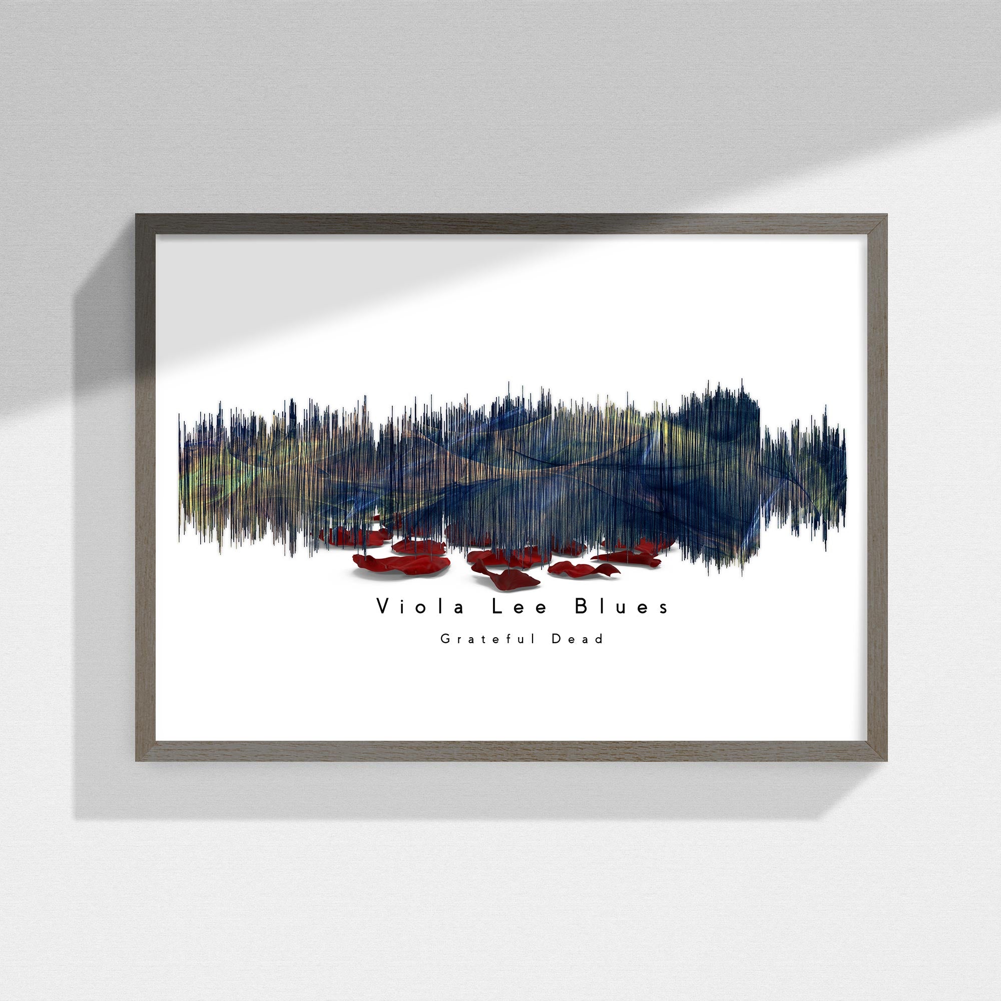 Framed Grateful Dead artwork of a watercolor design with text on a white wall