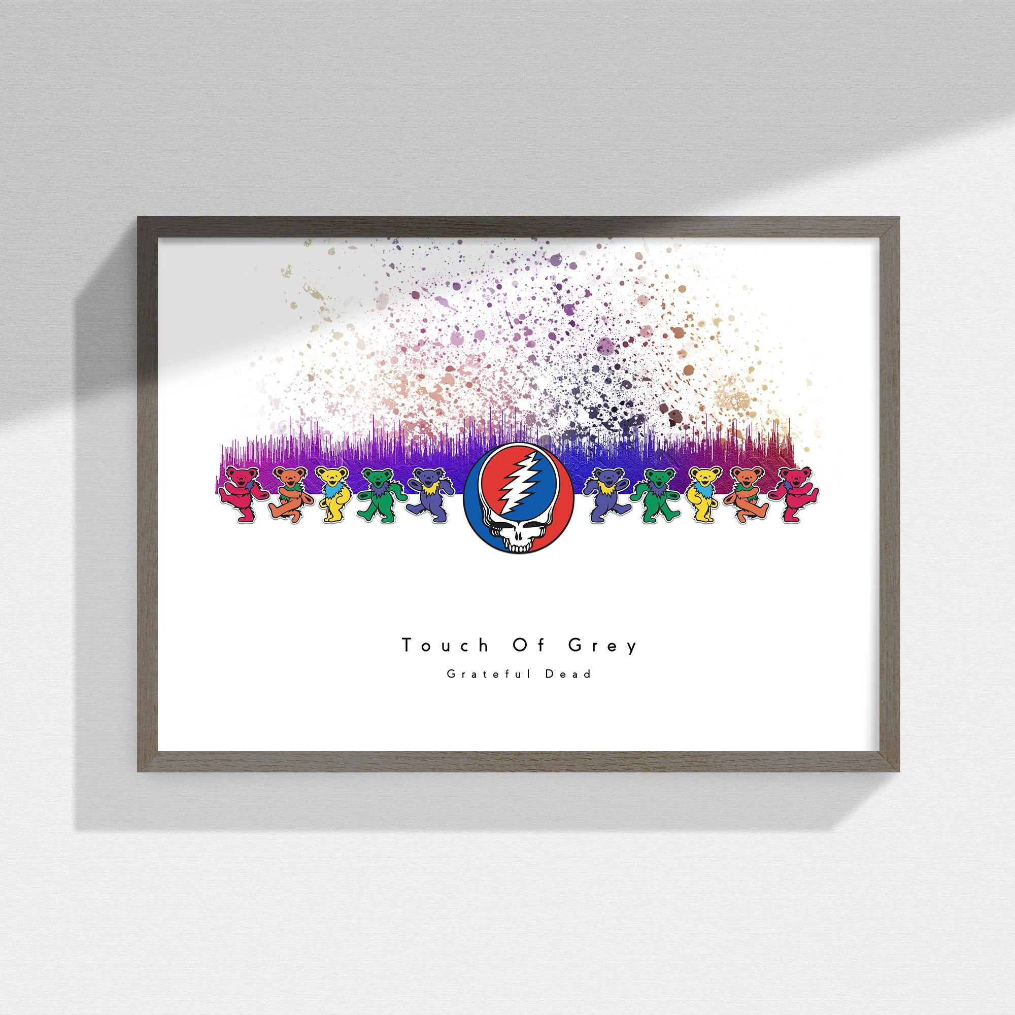 Framed Grateful Dead artwork with colorful bear illustrations and a logo on a white background