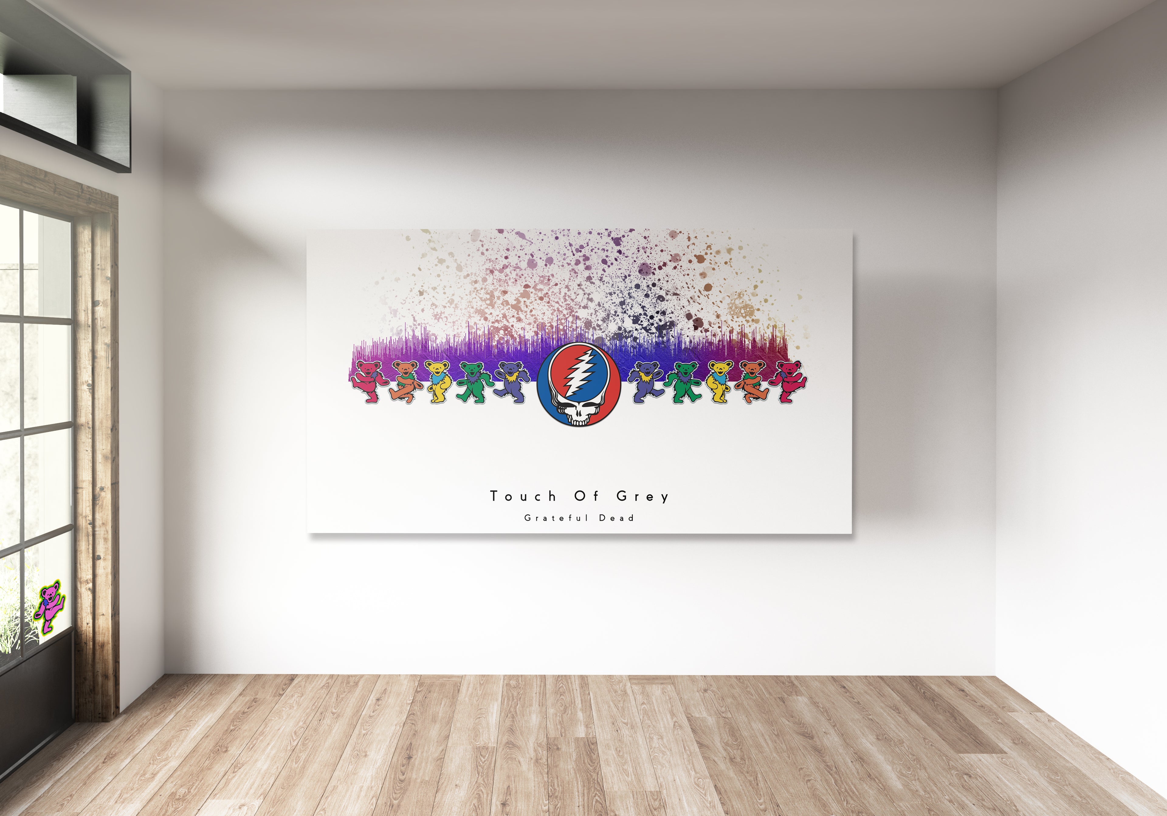 Colorful abstract art piece on a white wall in a room with wooden flooring.