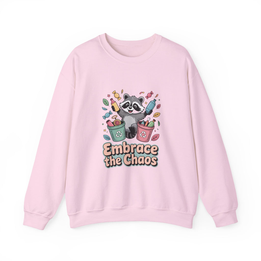 Pink sweatshirt with a raccoon graphic and 'Embrace the Chaos' text on a white background