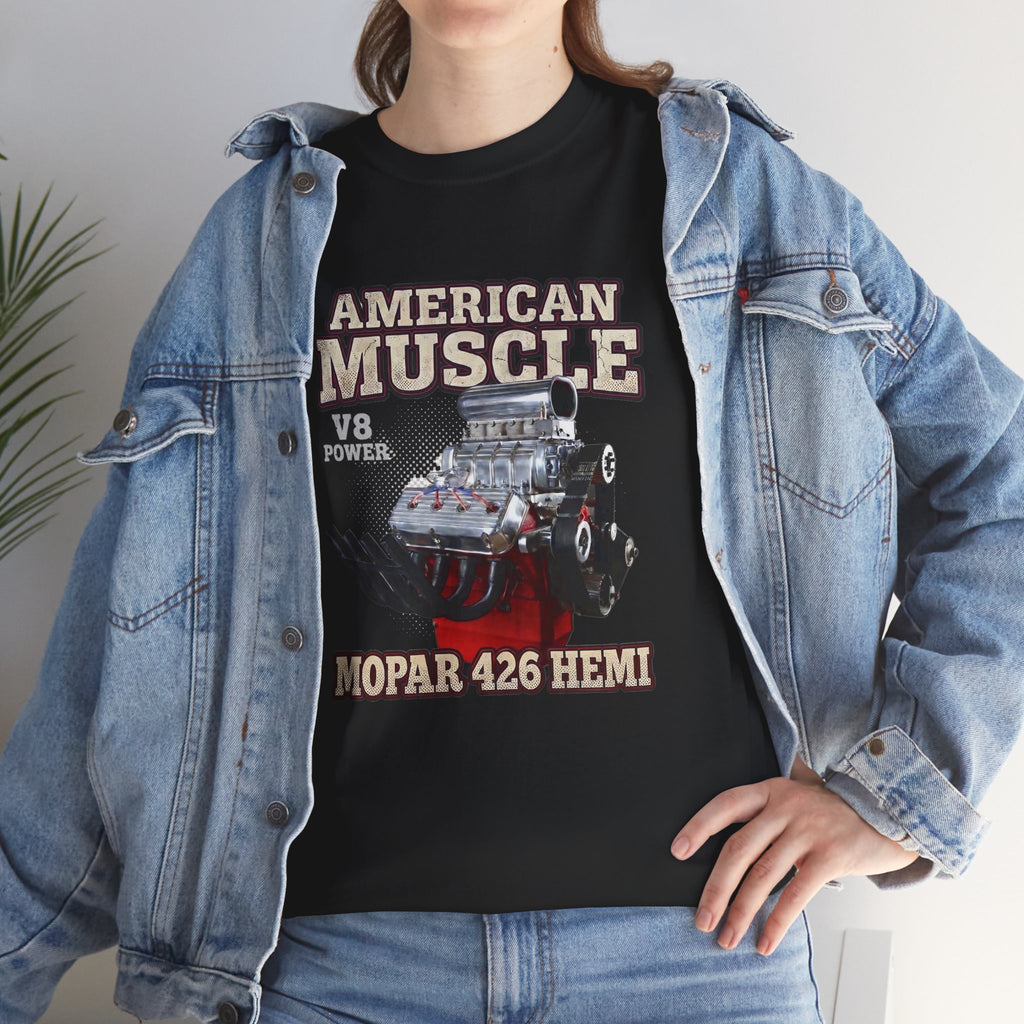 Person wearing a black t-shirt with 'American Muscle' graphic design, standing indoors.