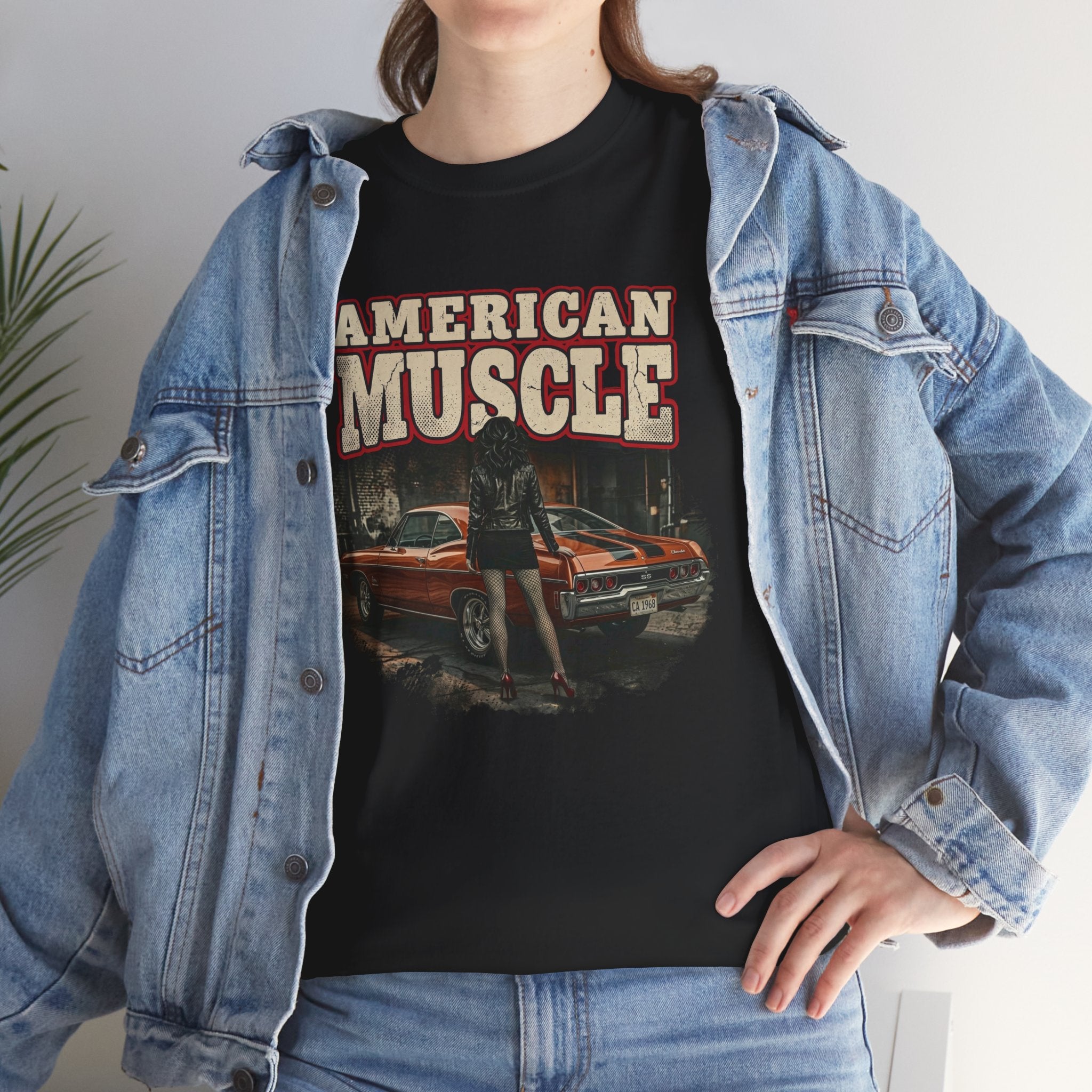 Person wearing a black t-shirt with 'American Muscle' graphic design, paired with a denim jacket.