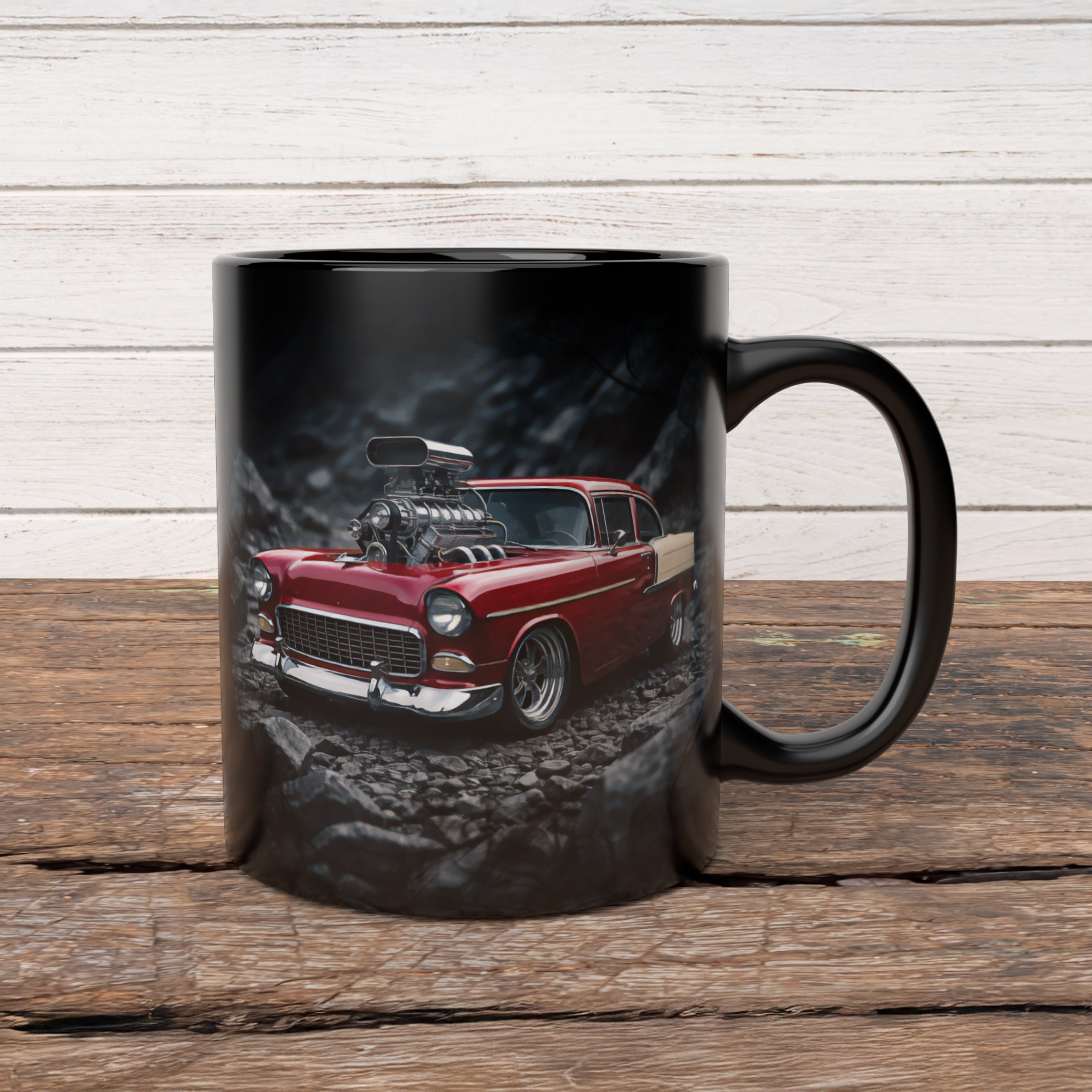 Black mug with a red classic car design on a wooden surface