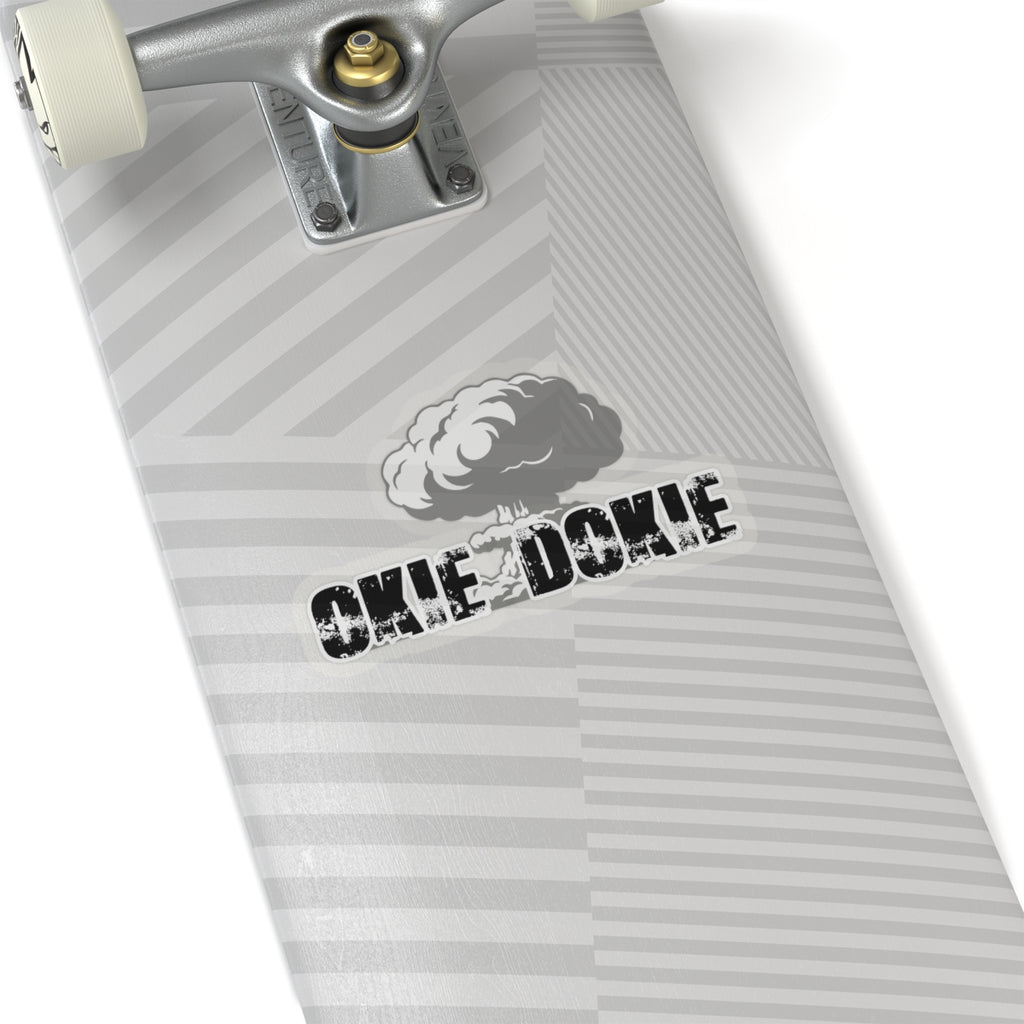 Close-up of a skateboard with 'Okie Dokie' branding on a white background