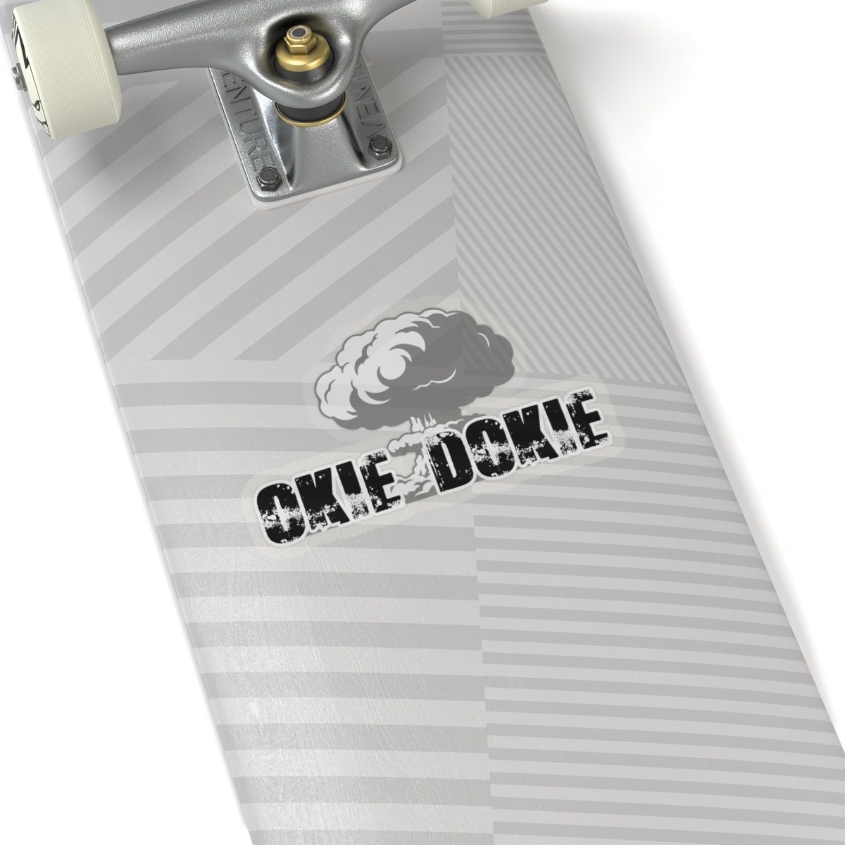 Close-up of a skateboard with 'Okie Dokie' branding on a white background