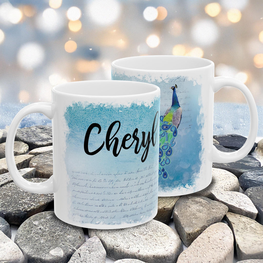 Two mugs with personalized designs on a stone surface with a blurred bokeh background