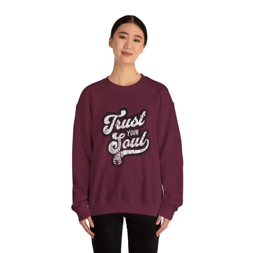 Model wearing a maroon 'Trust Your Soul' unisex crewneck sweatshirt, perfect for cozy casual wear and inspirational fashion.