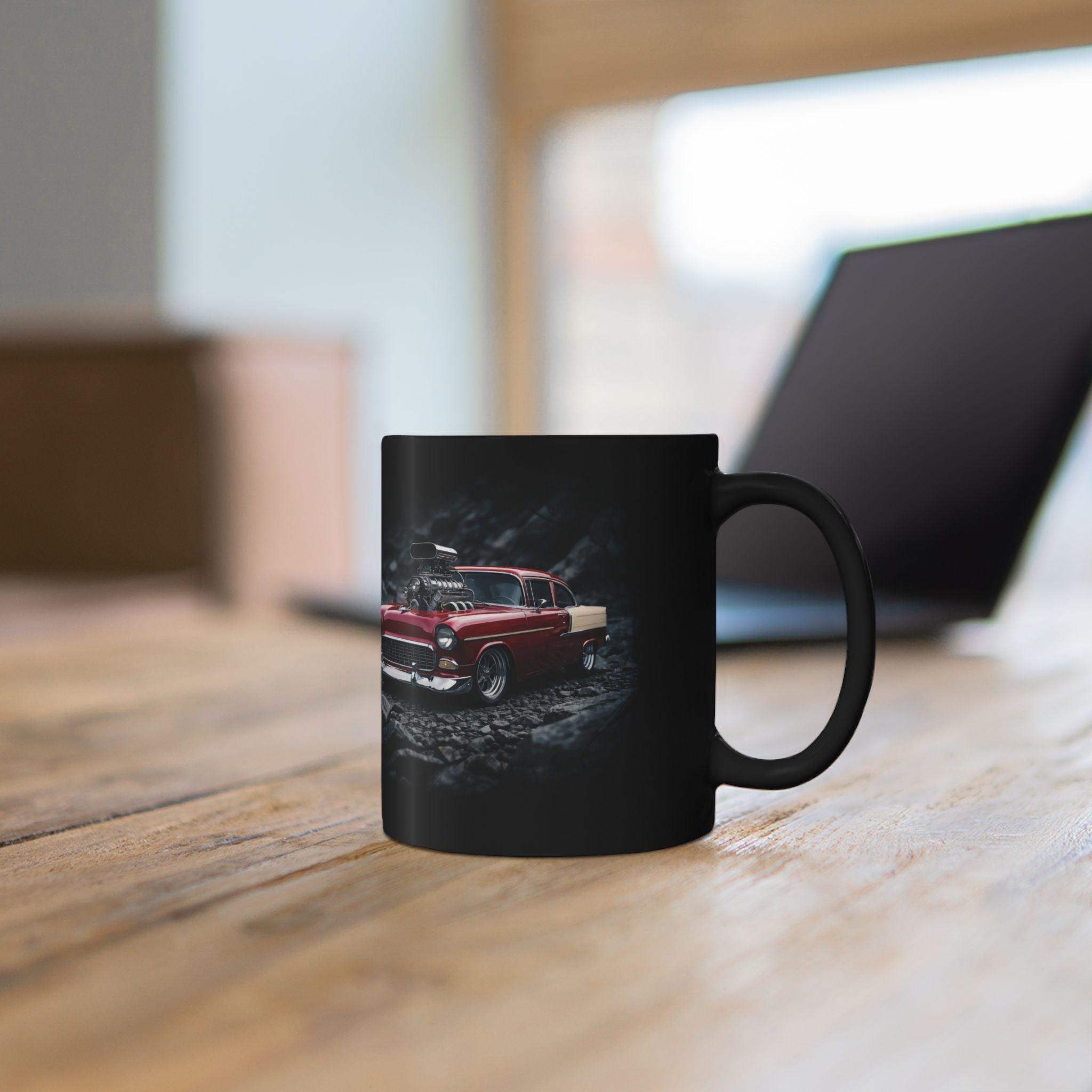 Black mug with 'Live with Intention' text on a wooden surface.