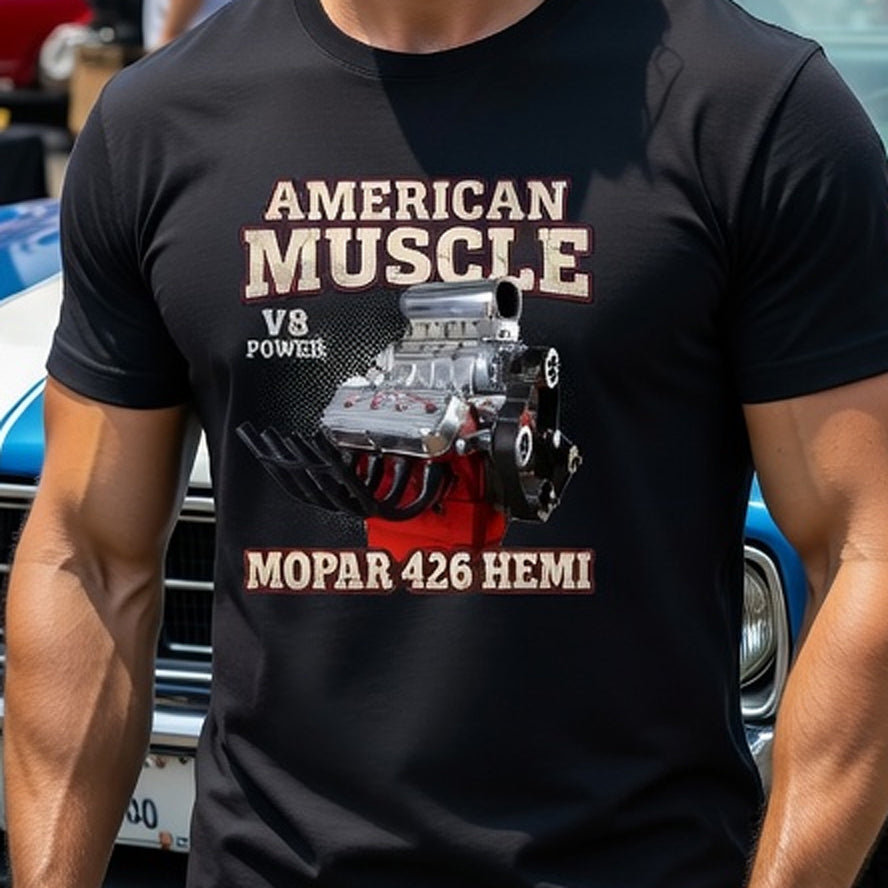Man wearing an 'American Muscle' t-shirt standing in front of a blue muscle car at a car show.
