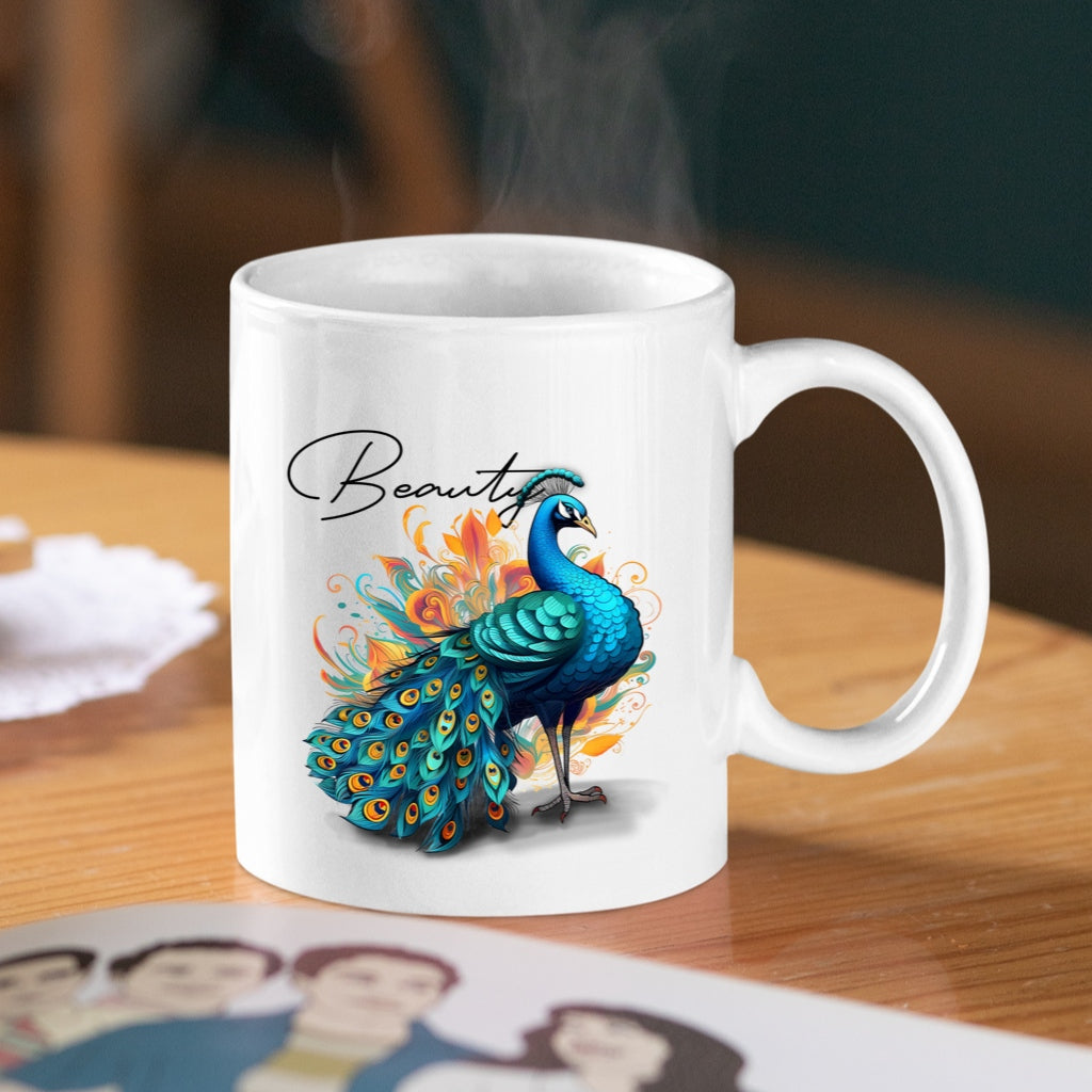White mug with a peacock design and the word 'Beauty' on a wooden table.