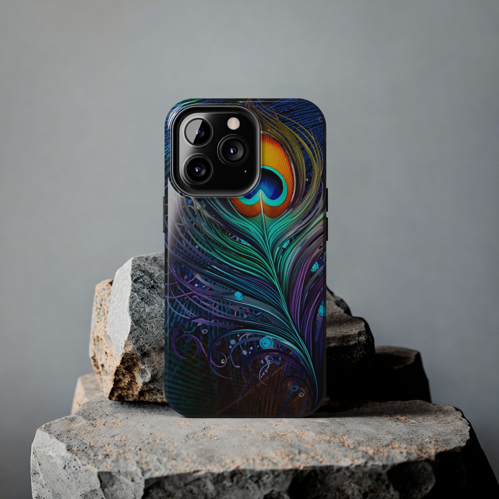 Phone case with peacock feather design on a gray background