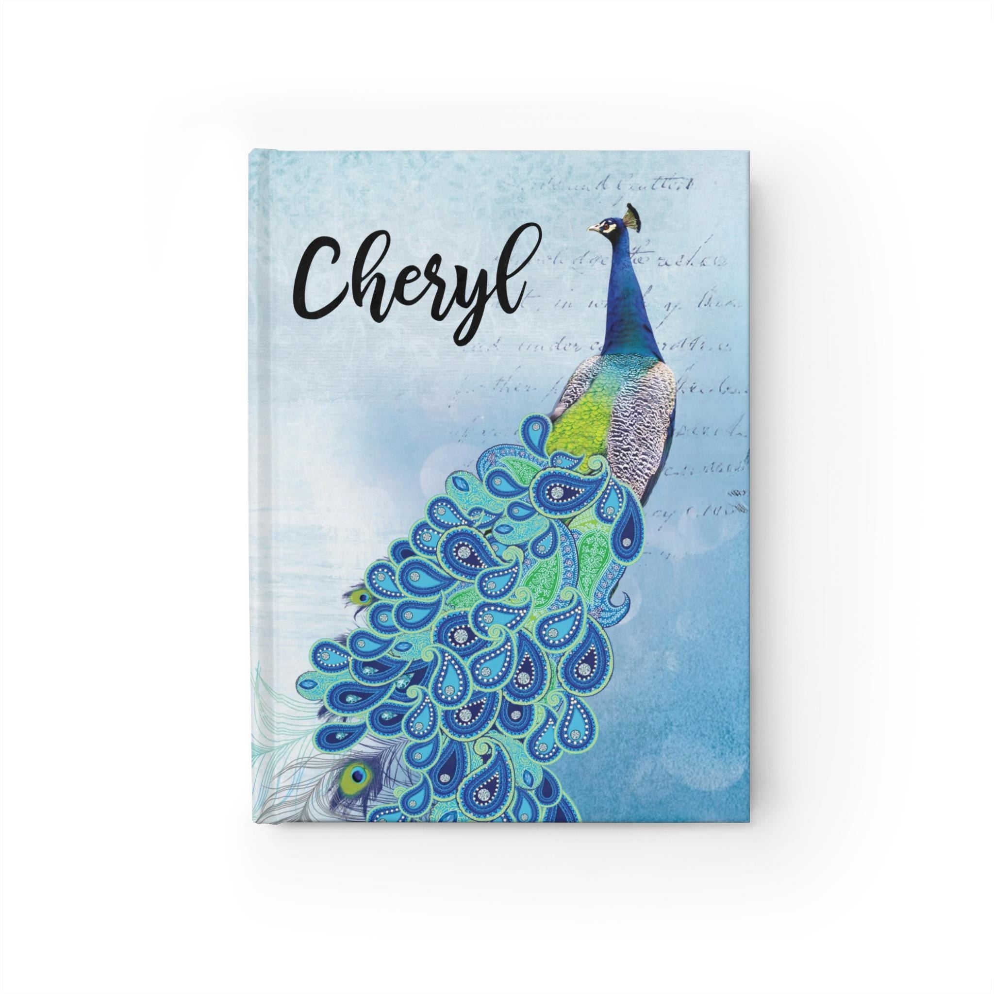 Personalized peacock journal with blue bird design and "Cheryl" on the cover, a customizable notebook for writing.