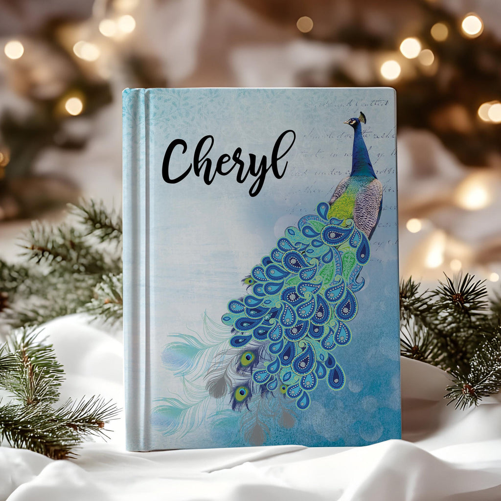 Personalized journal with a blue peacock design and custom name option, perfect for writing and sketching.