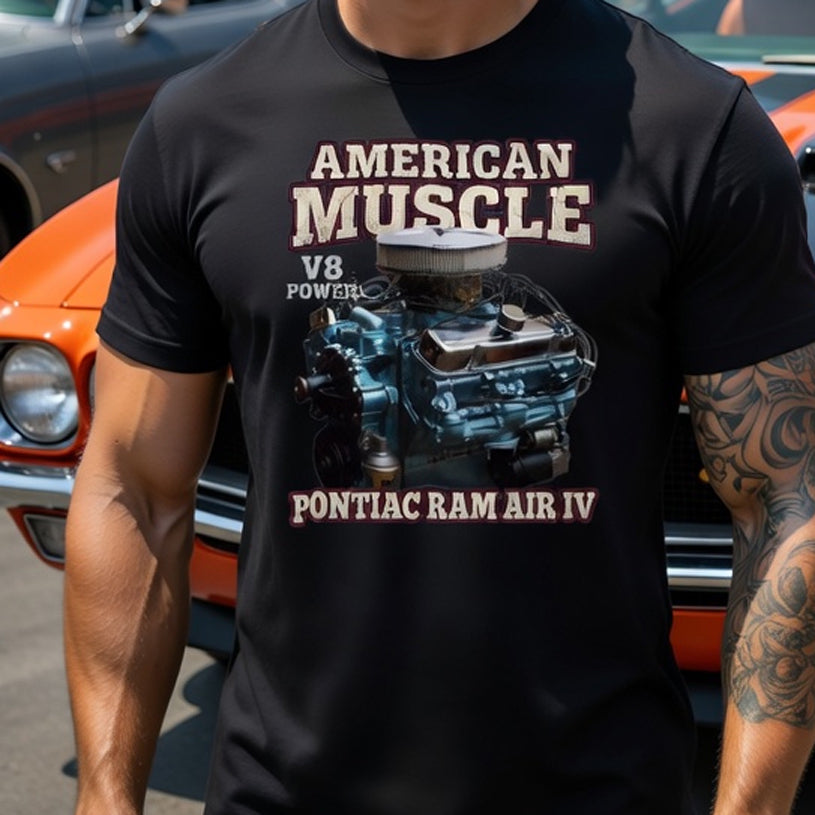 Person wearing a black t-shirt with 'American Muscle' and engine graphic, standing in front of a 1969 Pontiac gto ram air iv