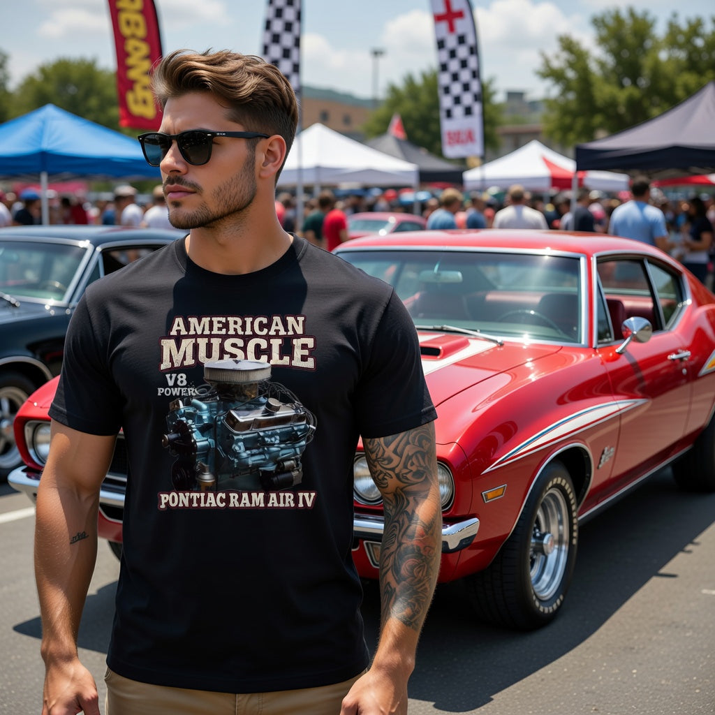 Man wearing a black t-shirt with 'American Muscle' design at a car show with a 1969 Pontiac ram air iv.