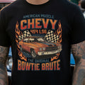 Black t-shirt with a graphic of a vintage car and text, worn by a person with tattoos.