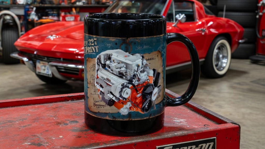 Black mug featuring a detailed print of a Chevy 327 engine, perfect for car enthusiasts.