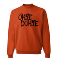 Fallout Amazon Show Orange sweatshirt with 'OKIE DOOKIE' text.